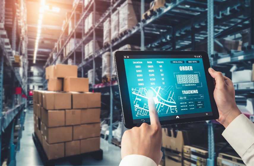 Person with tablet in warehouse